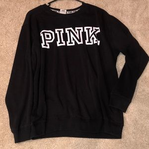 Black crewneck sweatshirt.